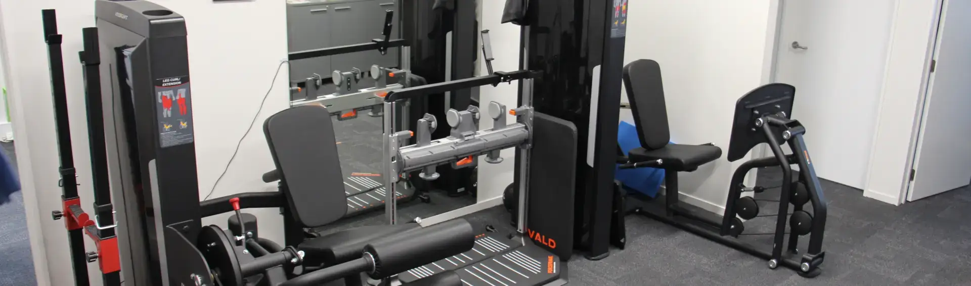 Physical therapy gym with leg extension machines